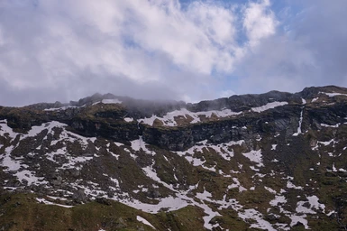 Mountain peaks in fog near Bâlea Lake.